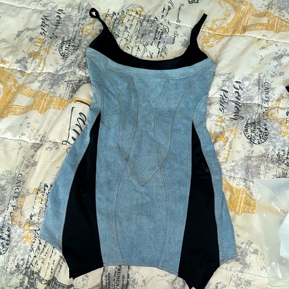 Very cute mini dress. Brand new, never worn. Too small